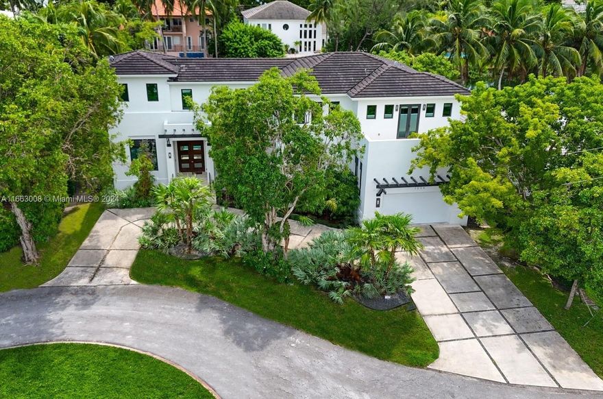 Located in the coveted and guard gated enclave of Gables By The Sea, this stunning two-story home built in 2015 features a grand entertaining main level anchored by a custom kitchen with SS appliances. Outside features a large pool w/ covered patio overlooking the waterway. (NO open bay access). This level also features a flex room that can be used as a bedroom or den. The convenient elevator takes you to the second level where the primary suite boasts 2 walk-in closets, large bath with soaking tub and a private terrace with commanding views of the waterway below. On this level are two additional bedroom suites. Add’l features are built-in sound system + security system. Living could not be easier in this beautiful home with vistas of the tropical landscape and waterfront throughout.