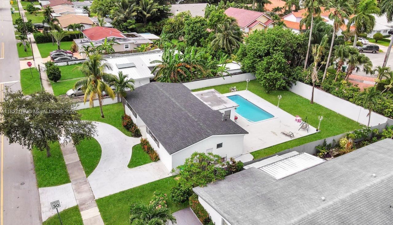 Gorgeous home near Aventura Mall and Worship home. This 1950's classic was remodeled to 2025 expectations. With lots of windows, this house is bright and light. This is your opportunity to buy. Split bedroom plan. Both bathrooms feature glass enclosures and modern finishes. Kitchen is a well equipped, galley style kitchen with stainless steel appliances. Separate laundry room plus additional storage area. Master bedroom is large for the neighborhood with a large walk-in closet. Pool area features a large cool-deck. Rear yard still has some grass to enjoy. Fully fenced yard & room for boat. Awesome guarded Highland Lakes neighborhood near Aventura yet no HOA. Close to I-95 and Biscayne Blvd. AS IS SALE!