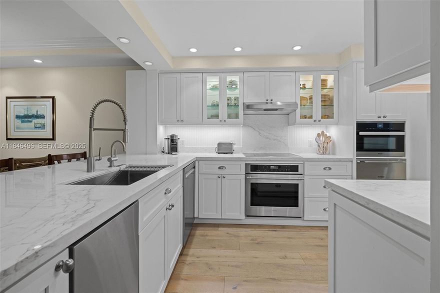 The ideal lifestyle in the heart of Coral Gables!  ENTRANCE ON THE BEAUTIFUL ALMERIA AVENUE, this tastefully redesigned townhome at Biltmore Court Villas faces the quiet tree-lined street. Open-concept living w/ a chef’s gourmet kitchen features custom cabinetry, sleek marble countertops, high-end appliances and storage galore. The white cabinetry theme is continued in both en-suite bathrooms and the downstairs half bath. Elegant finishes throughout: French oak hardwood flooring, plush carpet in bedrooms, a rebuilt staircase, new HVAC and electrical panel from the 2018 renovation. Convenient amenities: Elevator, 2 dedicated parking spaces, generous 40 ft storage unit, access to pool & BBQ in common area. Prime location: Minutes to Miracle Mile, UM, dining, shops, parks, trolly, and metro.