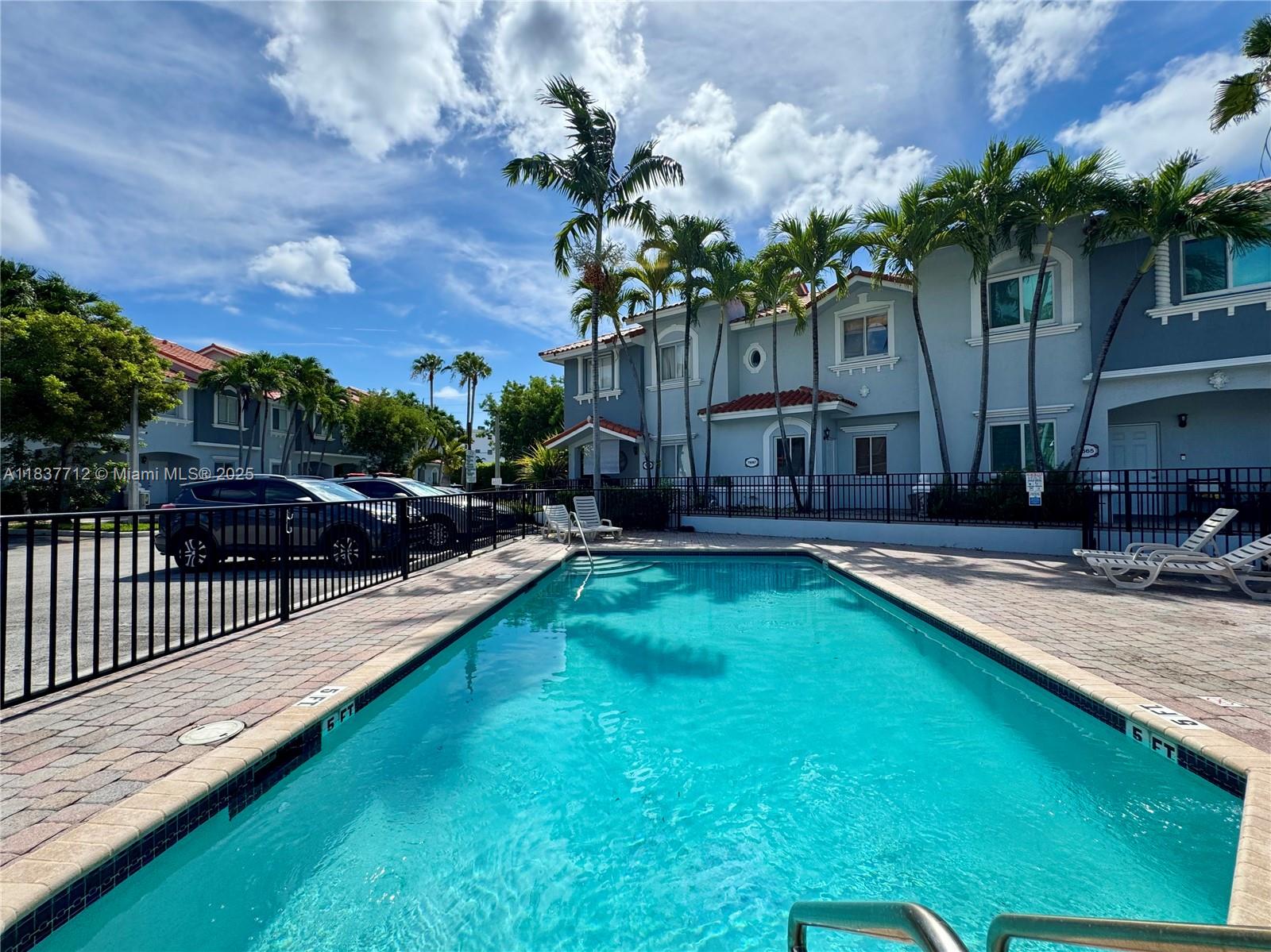 Immaculate townhouse featuring 2 bedrooms and 1.5 bathrooms, with beautiful laminate wood flooring throughout. The open-concept kitchen offers granite countertops and abundant natural light, with views of the pool and private patio. The spacious living area is located on the first floor, while both bedrooms are upstairs for added privacy. Enjoy a private fenced patio, two assigned parking spaces, and ample guest parking. This gated and secure community consists of only 25 units and includes a community pool. Ideally located in the heart of North Miami, just blocks from Biscayne Blvd, shops, Whole Foods, and only minutes from the beach. A rare find — don’t miss this opportunity!