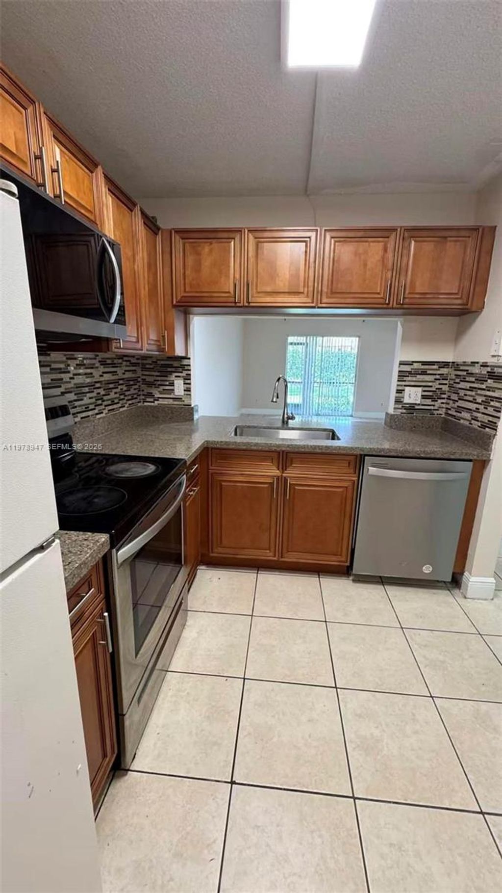 Photo of 10349 NW 8th St #106, Pembroke Pines, FL 33026 (MLS # A11978947)