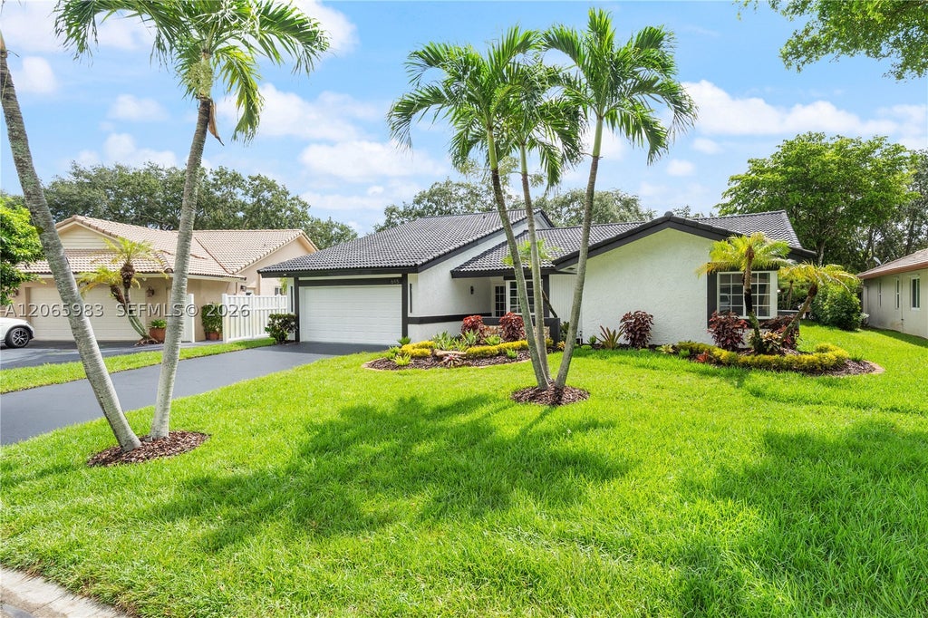 Photo of 695 NW 107th Ln, Coral Springs, FL 33071 (MLS # A12065983)