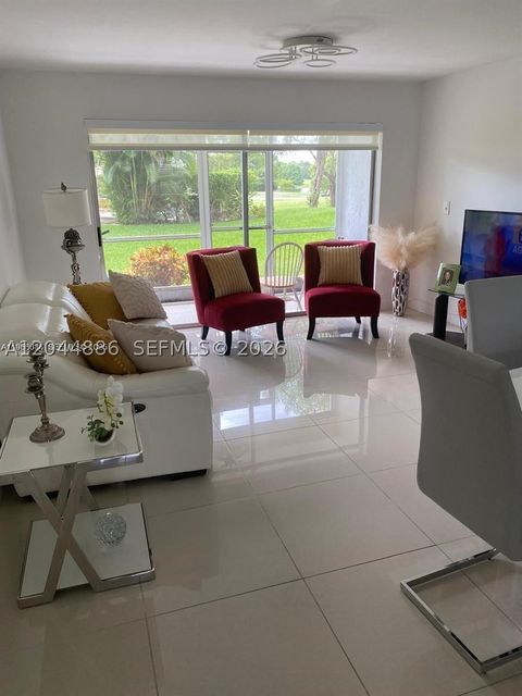 Photo of 8838 W Mcnab Rd #104, Tamarac, FL 33321 (MLS # A12044886)