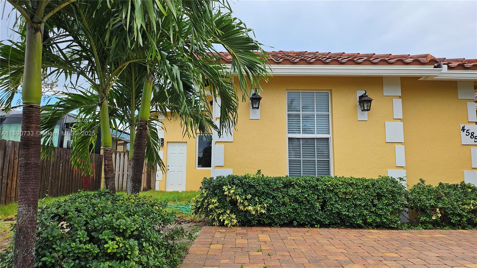 Built in 2017, this modern home offers luxury finishes throughout. Features include stainless steel appliances, built-in microwave and dishwasher, filtered water and ice dispenser, hurricane-impact windows and doors, granite countertops, crown moldings, premium tile flooring, and ceiling fans throughout. Enjoy a private brick patio and side yard. Utilities include FPL electric and Palm Beach County water service. No HOA. Located on a quiet dead-end street. In September 2025, a permitted 2-bedroom, 1-bath addition (approx. 405 sq. ft.) was completed. Ideal as a guest suite, home office, or rental unit. Additional upgrades include a new water heater, new dishwasher, and fresh interior and exterior paint. Boat and RV parking permitted.