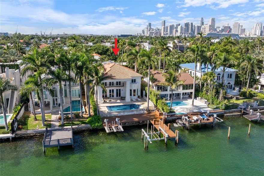 305 N Hibiscus Dr is a rare gem on guard-gated Hibiscus Island offering true Miami waterfront living. This 5-bedroom, 5-bath plus half-bath residence spans over 5,100 sq ft on a 10,260 sq ft lot. With direct ocean access from a 60+ ft dock with lift accommodating a 35-ft boat and, the home delivers luxurious indoor/outdoor living with pool, soaring ceilings, marble floors, and sweeping water views. Hibiscus Island is one of Miami Beach’s most coveted addresses—exclusive, serene, and centrally located between Downtown and South Beach. Residents enjoy a community playground, basketball and tennis courts, all within the security of a gated enclave. This is waterfront prestige at its purest.
