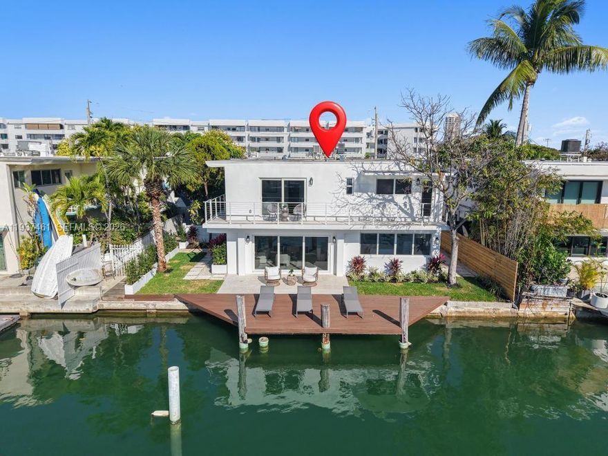 Prime Waterfront Gem in Miami Beach 7286 Gary St. Location, Location Location! Welcome to this beautifully remodeled waterfront property featuring a rare 60 FT dock on a wide canal with direct, bridge free access to the bay.  Walking distance to the beach. Inside, you will find 1,632 SqFt of luxurious living space. This home has been completely updated with brand new electrical, plumbing, HVAC, roofing and gas lines. The first floor boasts elegant white porcelain tile floors, a modern white kitchen with quartz countertops and new appliances, and expansive impact windows and doors the provide the home with natural light and stunning water views. Upstairs, you'll find 3 bedrooms with engineered wood floors and a large wraparound terrace to enjoy those serene water vistas. The bathrooms are appointed with elegant marble floors, and the property features manicured landscaping and a spacious yard perfect for entertaining. Home is equipped with alarm system. NO HOA!