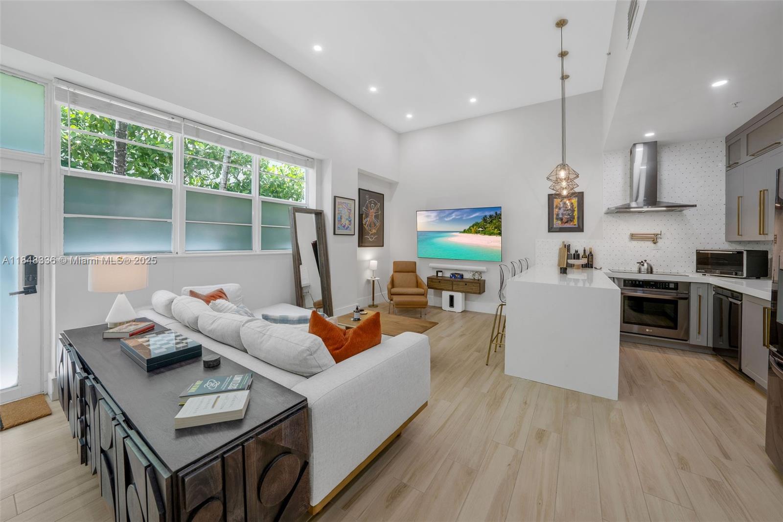 A true one-of-a-kind in the heart of Miami Beach’s iconic Art Deco District! This fully furnished 1-bedroom residence at Nolobi, designed by renowned architect Chad Oppenheim, seamlessly blends historic character with modern luxury. Soaring 12.5-ft ceilings create a bright, airy feel, while the custom kitchen features oversized cabinetry, black stainless steel appliances, and top-tier finishes, all enhanced by a state-of-the-art smart lighting system. The bedroom offers exceptional storage with a custom floor-to-ceiling closet and an additional walk-in, and the spa-inspired bathroom boasts dual shower heads, a sleek ceramic vanity, and contemporary fixtures for a true retreat experience. Washer & dryer inside unit! Located four blocks from the pristine sands of South Beach!