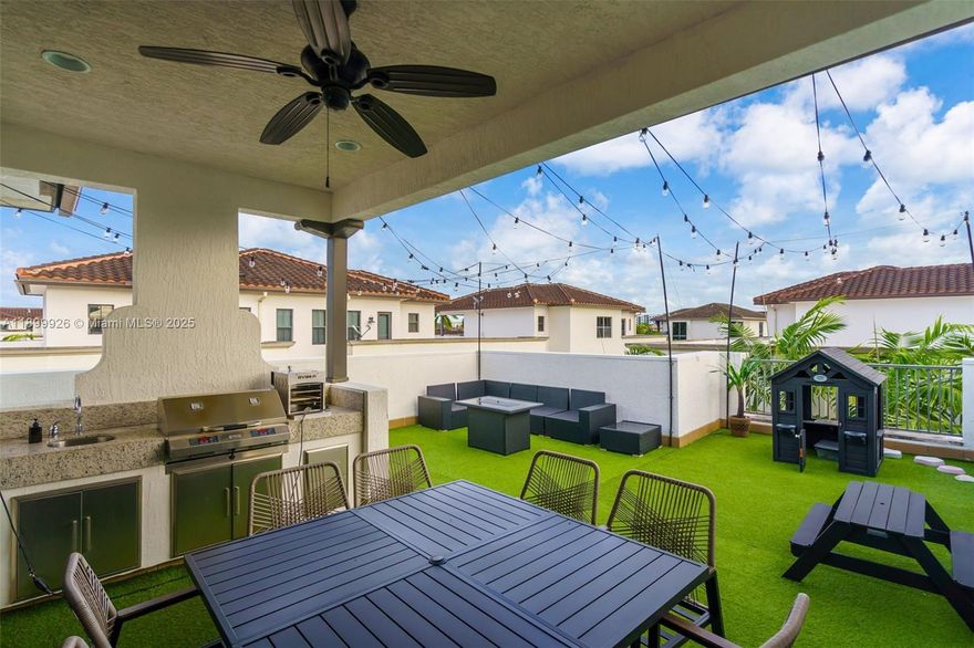 In the heart of Downtown Doral, Miami’s premier town center of culture and convenience. This elegant three-story corner townhome features 5 bedrooms, 4 bathrooms, and a two-car garage, blending modern luxury with effortless comfort. Entertain on your private rooftop terrace with built-in BBQ and sink, or cook in the gourmet kitchen with Monogram appliances, Italian glass cabinetry, and granite countertops. Enjoy a walkable lifestyle surrounded by award-winning schools, fine dining, boutiques, and easy access to Miami International Airport, major highways, universities, and Trump National Doral, the perfect balance of sophistication, culture, and connection
