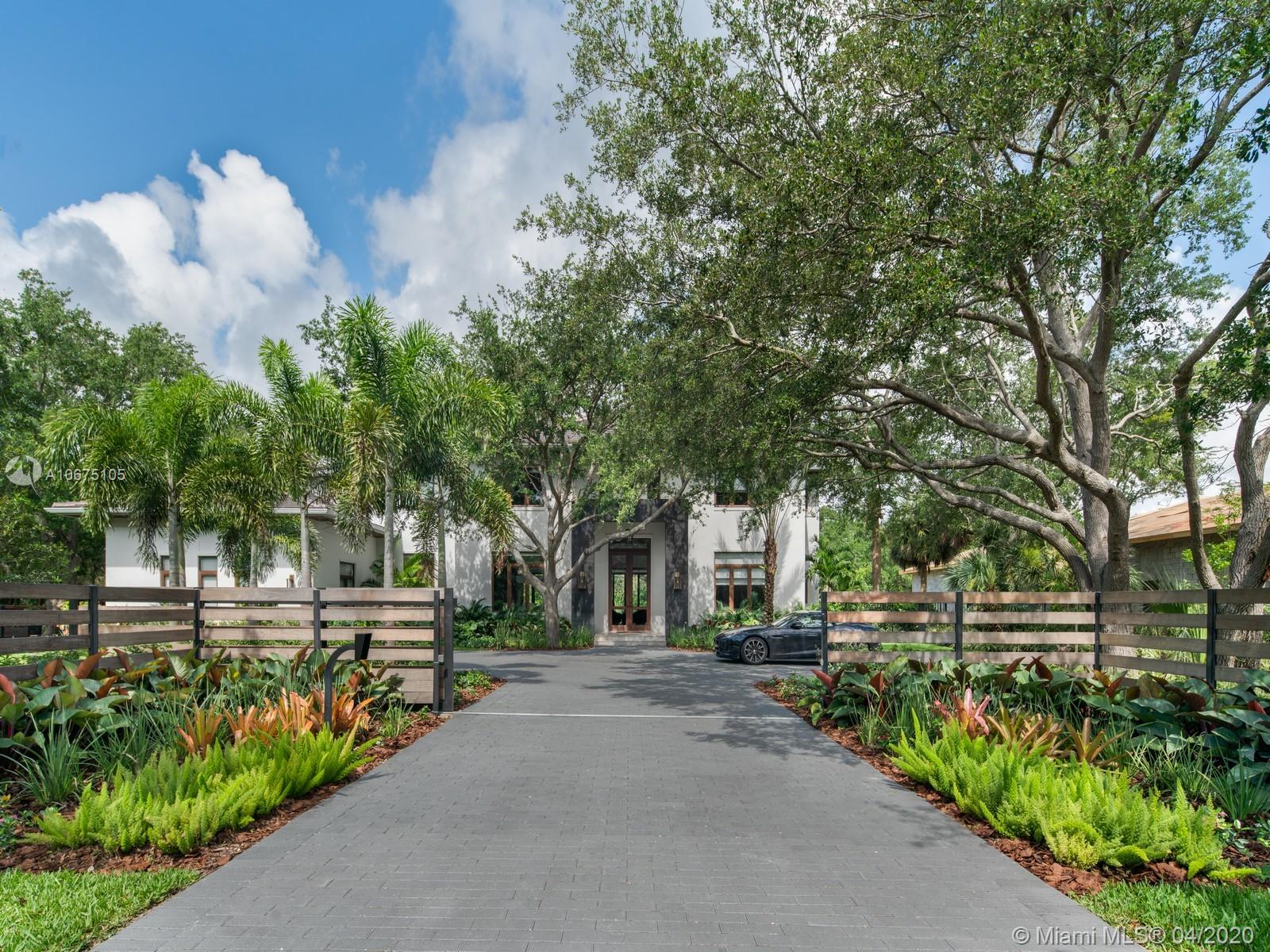Spectacular new home sitting on a beautifully landscaped corner lot in prime North Pinecrest. This contemporary estate has been finished to perfection & is the perfect setting for family living & entertaining. Living room with built in bar & spacious dining room. Stunning eat-in Mia Cucina Kitchen with top of the line appliances & breakfast area. Glass doors open to covered terrace with outdoor kitchen, resort style pool & spacious yard. 5 en-suite brms + service quarters, media room, Gym & bonus room off Master. Exquisite Master with spa like bath, oversized closet & huge master terrace. Nuvo technology controls lights, music, cameras, ACs & alarm from your phone. 3 car garage, elevator & generator. Close to Miami’s best schools & minutes from South Miami & Coral Gables.