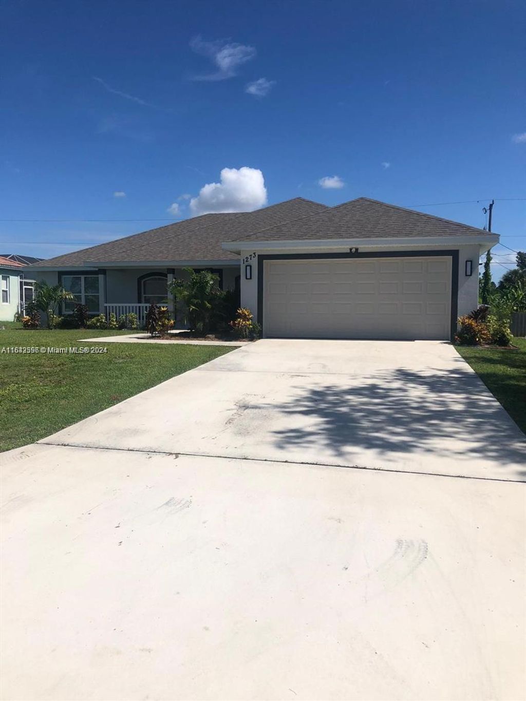 Photo of 1273 SW Melrose Ave, Port Saint Lucie, FL 34953 (MLS # A11643596)