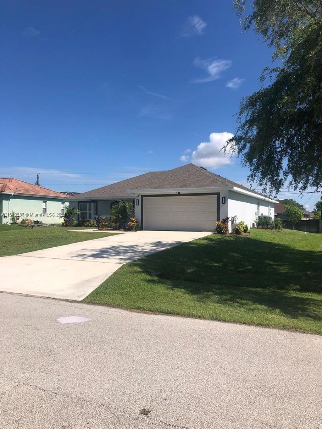 Photo of 1273 SW Melrose Ave, Port Saint Lucie, FL 34953 (MLS # A11643596)