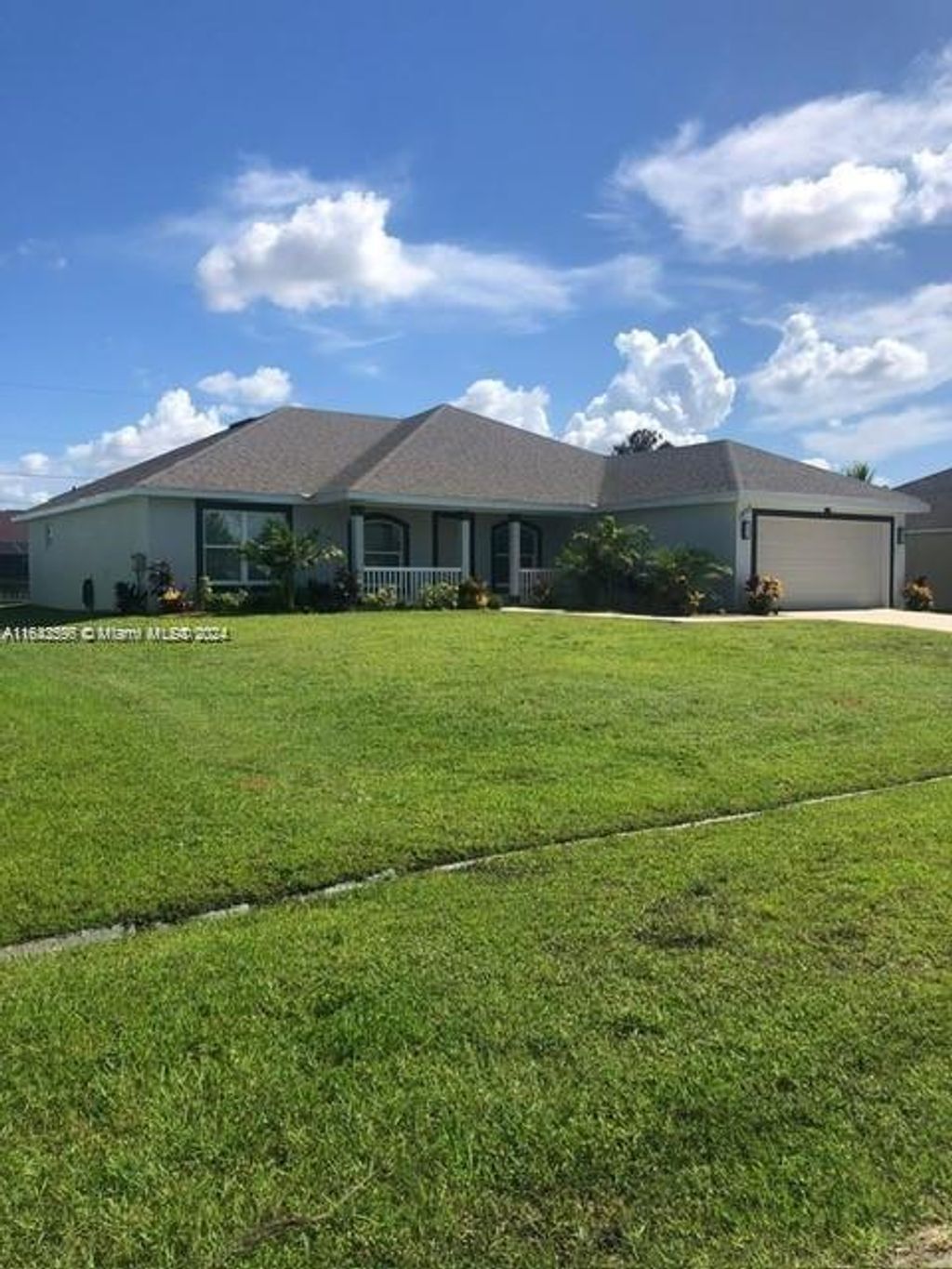 Photo of 1273 SW Melrose Ave, Port Saint Lucie, FL 34953 (MLS # A11643596)