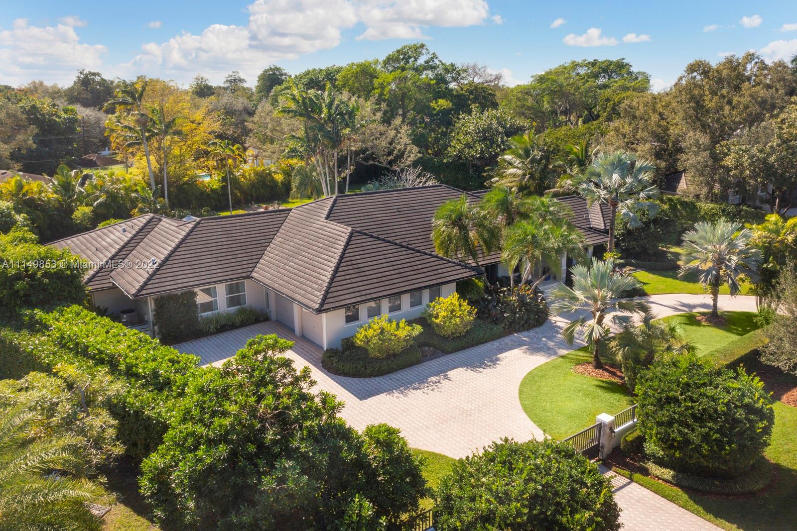 Gorgeous sophisticated fully gated and private acre family home on one of the most desirable streets in all of Pinecrest! Superb split plan layout which includes master + office on one side, and 4/3 on other side including large kids family room/playroom. 2020 whole house gas generator, 8-year old flat tile roof, new resort style pool area, huge bedrooms, large kitchen w/gas range, and enormous and oversized covered patio with built-in grill. Expansive yard space with field to play, fire pit and a beautiful lush landscape perimeter. When only the best of North Pinecrest will do!