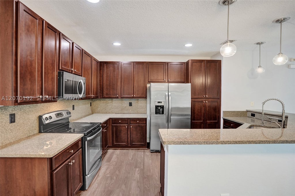 Photo of 6079 Grand Cypress Cir W, Coconut Creek, FL 33073 (MLS # A12070192)