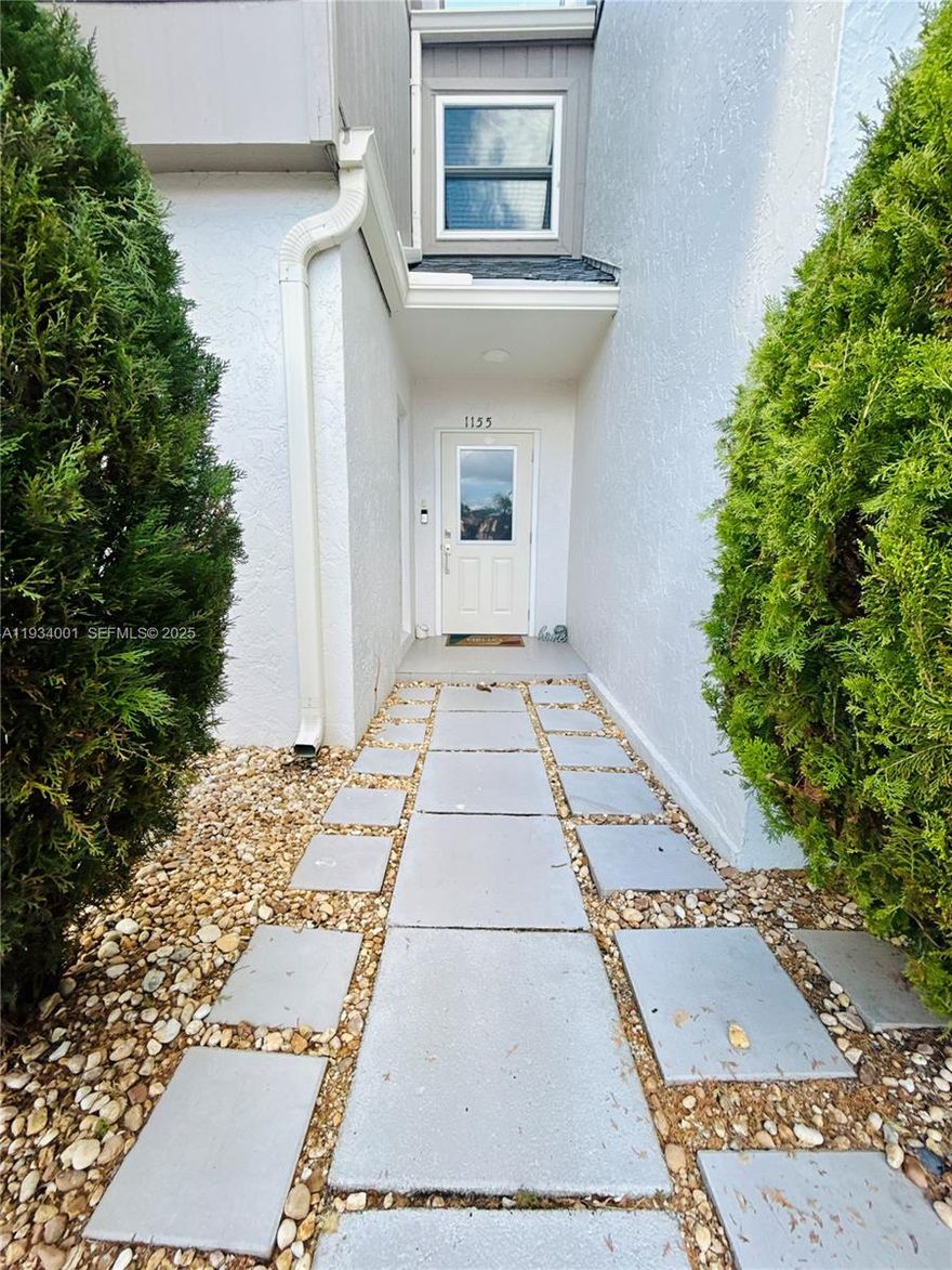 Stunning waterfront townhome in the heart of Wellington with NO HOA. This owner-occupied home has been extensively renovated and is truly one of a kind. Major upgrades include a NEW 2025 roof, NEW impact windows, NEW luxury waterproof vinyl flooring throughout, NEW water heater, NEW 5¼" baseboards, and all NEW outlets and light switches. The fully renovated kitchen features real wood, self-closing cabinetry, quartz countertops, and NEW Samsung stainless steel appliances. Both bathrooms have been beautifully updated with real wood vanities with quartz tops, modern shower wall designs, NEW Moen/Kohler fixtures, NEW toilets, and a frameless glass shower enclosure in the primary bath. Enjoy peaceful waterfront views, modern finishes, and move-in-ready comfort in one of Wellington’s most desirable locations.

Text for title company information. Pre-approval and/or proof of funds required with all offers. All information provided herein is deemed reliable but not guaranteed; buyers are advised to verify.