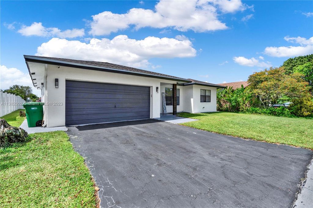 Photo of 9630 NW 83rd St, Tamarac, FL 33321 (MLS # A11382002)