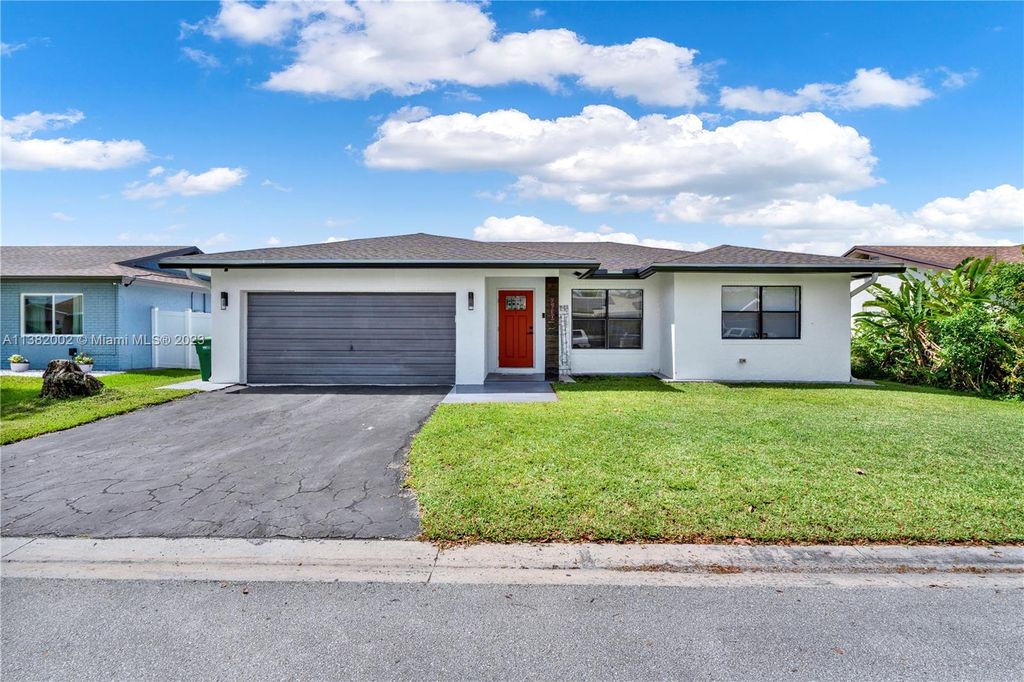 Photo of 9630 NW 83rd St, Tamarac, FL 33321 (MLS # A11382002)