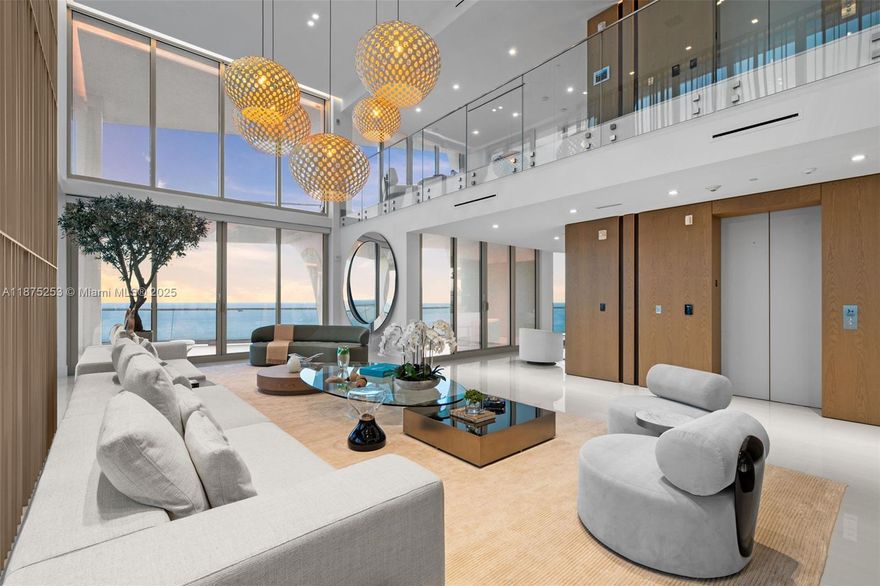 Welcome to Sky Villa 5105 at Jade Signature, a rare two-story residence in the sky curated entirely by Artefacto. Spanning over 6,500 SF, this 5-bedroom, 6.5-bath home offers soaring double-height ceilings, walls of glass, and seamless indoor-outdoor living with expansive terraces + service quarters. Every space is masterfully designed with bespoke finishes, custom millwork, and a private elevator. The oceanfront primary suite offers a spa-inspired bath and oversized dressing room, while a private elevator ensures effortless access. Residents enjoy resort-style amenities including beachfront service, world-class spa, fitness center, kids’ club, wine bar, valet, and full concierge. An unmatched lifestyle of elegance and ease awaits.