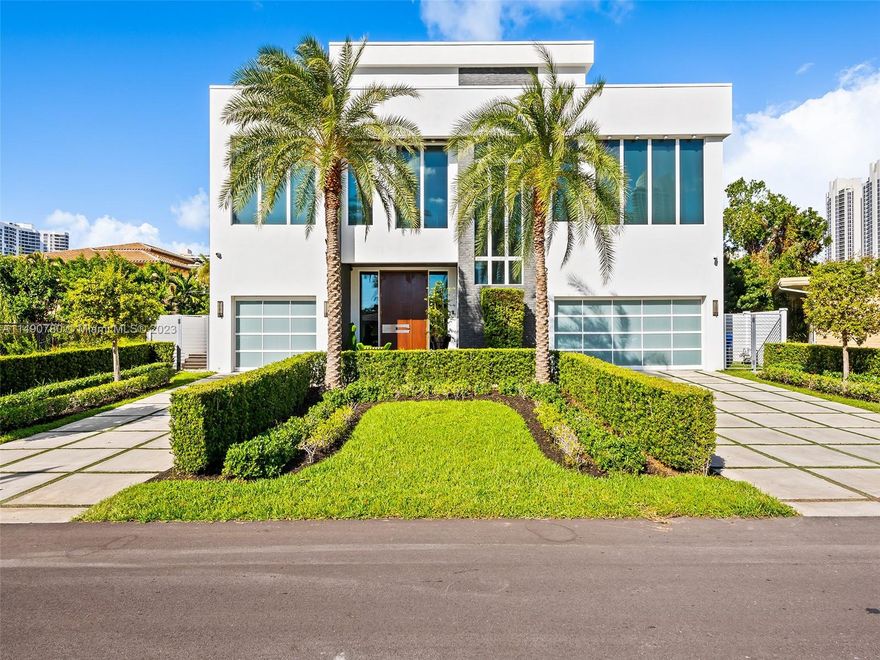 Crafted to perfection in world-renowned Sunny Isles Beach, this home stands steps away from Miami’s top beaches. Spanning 6,254 sq ft, offering 5 beds, 5.5 baths, office, & chef’s kitchen with Neolith countertops, The kitchen boasts meticulous modern design, Mia Cucina decor, Miele appliances including a 36” Sub-Zero refrigerator,36”  freezer, beverage cooler & 24” wine cooler.  Custom floors/wallpaper, Oak wood floors upstairs, Home automation, Steam shower, heated towel warmers enrich this smart home. Outdoors include a heated salt-water pool with a summer kitchen. Spacious 3-car garage & camera system. A fusion of function and style, it offers comfort and luxury with prime location and contemporary elegance. Walk to houses of worship. High-end Italian imported furniture negotiable.