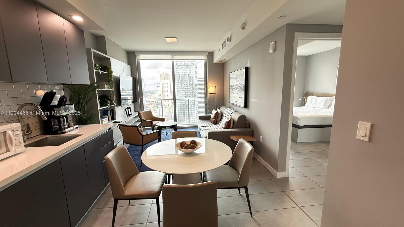 Discover the perfect investment opportunity at YotelPad. A modern, fully furnished 1 bedroom,1 bath residence designed for style, comfort, and functionality. This sleek unit  swocases high-end finishes, floor-to-celling windows, smart home technology, and an open-concept layout that maximizes both space and natural light. The gourmet kitchen features stainless steel appliances, a spa-inspired bathroom, and a private balcony offering stunning downtown skyline views.
Resident enjoy access to world-class amenities including a rooftop pool , fitness center, co-working space concierge, valet parking and vibrant social lounge.