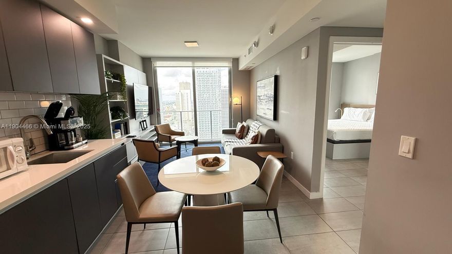 Discover the perfect investment opportunity at YotelPad. A modern, fully furnished 1 bedroom,1 bath residence designed for style, comfort, and functionality. This sleek unit  swocases high-end finishes, floor-to-celling windows, smart home technology, and an open-concept layout that maximizes both space and natural light. The gourmet kitchen features stainless steel appliances, a spa-inspired bathroom, and a private balcony offering stunning downtown skyline views.
Resident enjoy access to world-class amenities including a rooftop pool , fitness center, co-working space concierge, valet parking and vibrant social lounge.