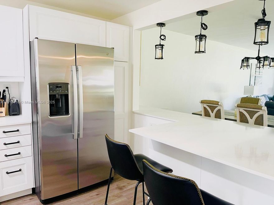 Discover this charming and tastefully renovated 2-bedroom, 2-bath condo located in the highly sought-after Hollybrook Golf & Tennis Club. This inviting first-floor residence features a beautifully updated kitchen with luxury finishes, perfect for both cooking and entertaining. Enjoy serene greenery views from your private patio, creating a peaceful retreat after a day of activities. Hollybrook is an exceptional community for golfers, pickleball players, and tennis enthusiasts, offering two golf courses—one of them a par-3 executive course—along with top-tier tennis and pickleball facilities. The clubhouse features a full-service restaurant, adding convenience and enjoyment to your lifestyle. Move-in ready and full of charm, this condo offers comfort, style, and resort-like living.