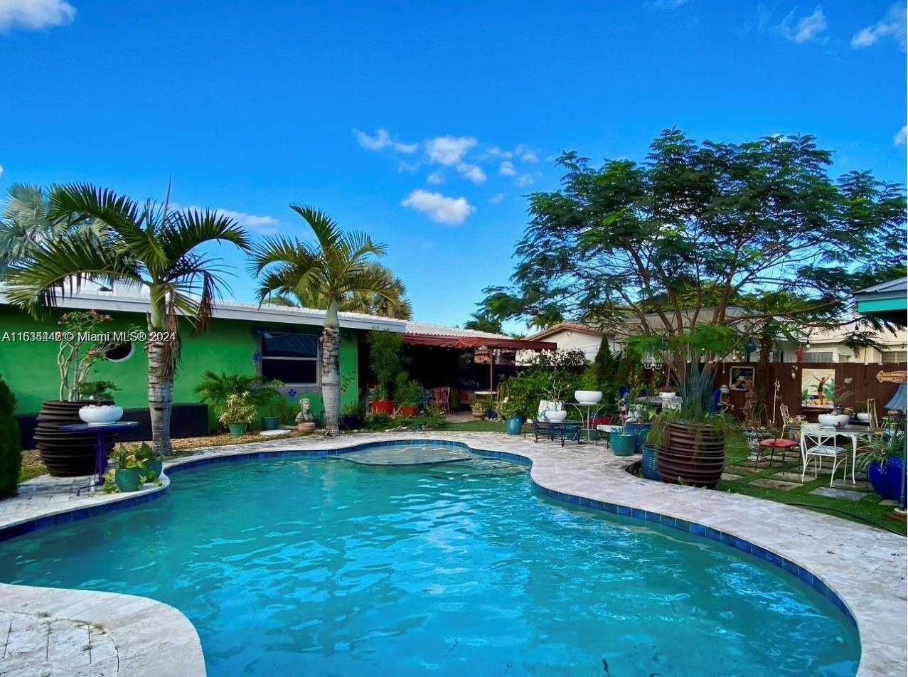 OVER 2000 TOTAL SFT Charming & Cozy French country meets old world vintage charm in this unique and color filled Hollywood Hills home featuring 5 BDRMS, 2 BTHS & a 200 SqFt pool house that can be converted into a 6th bedroom. Featuring hurricane windows & doors, original hardwood floors from the 1950s, venetian plaster, wood shutters, wood-burning fireplace & architectural details moldings. Including custom-made kitchen cabinets, kaleidoscope granite countertops, soapstone countertops, stainless steel appliances, cast iron built AGA gas stove & Mexican tile floor. Large double lot backyard w/ swimming pool, travertine marble deck, beautiful plants & landscaping, outdoor entertaining area including a wood deck with pergola and a fire pit. Full front porch, Turkish marble Driveway. Must see