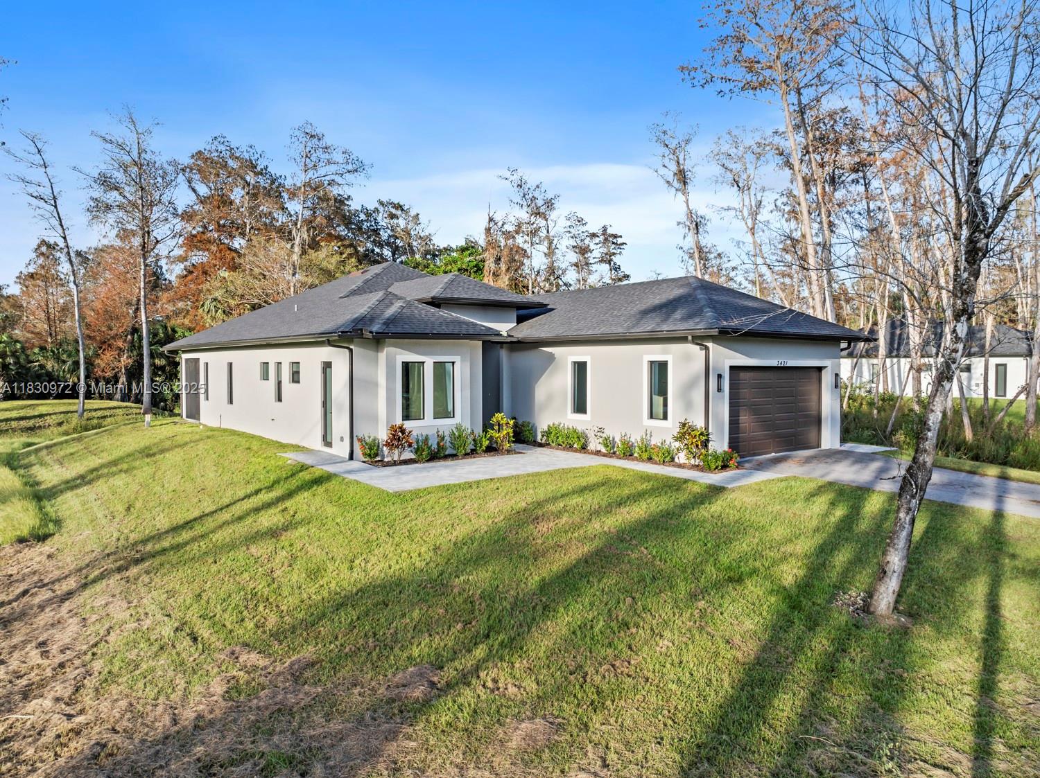 Stunning Portofino Model on 2.5 Acres!
Discover this exceptional Portofino Model, featuring 3 spacious bedrooms plus a dedicated office with its own private entrance, 3 full bathrooms, and a roomy 2-car garage. This beautifully crafted home showcases elegant tile flooring throughout and is equipped with sleek White Glass Appliances.
The gourmet kitchen is a showstopper, offering a modern island with a waterfall edge and convenient electrical pop-ups, seamlessly flowing into the open-concept living space that captures breathtaking views of the natural surroundings. Enjoy outdoor living year-round on the screened lanai, with a paved driveway providing easy access and a reverse osmosis system ensuring pure water for your family. Perfectly situated on a 2.5-acre lot in a prime location .