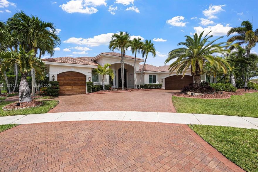 Nestled at end of a Cul-de-Sac on an oversized Lot with wrap around Lake views makes this a perfect home!  Recently renovated home consisting of 6 bedrooms, 4.5 Baths, an office, full IMPACT Windows and Doors and new Solar Panels included in sale. Monthly bill averages under $150 during low season and under $250 during high season. 2 Newer A/C units installed 4.5 years ago, Full Sonos Sound System, Remote controlled Zebra Blinds throughout, updated Kitchen with Quartz countertops & Thermador appliances. Master bedroom has newly renovated His/Her bathrooms. Travertine patio pavers, Tiki Hut with Outdoor Kitchen. Community amenities: Tennis, B-ball & Pickleball courts, pavilion & playgrounds.