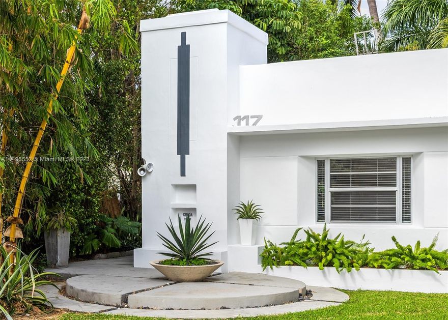 This sunny and sophisticated Art Deco bungalow plus guesthouse on San Marino Island offers a midmod environment that bursts with color. Enjoy the privacy of a lush backyard with pool and garden complemented by a mid-century interior design by renowned Robert Kaner. Representing Miami Beach’s ‘style moderne’ at its finest, this is an opportunity to own a piece of history on the Venetian Islands. Ornamental details and vibrant, citrusy colors throughout create a low-key ode to 1930s tropical modernism with a touch of minimalist exuberance. A bright living space with white terrazzo flooring welcomes you into an open layout. The den, adorned with custom, vintage pieces, offers a tranquil escape with its warm, subdued colors, a contrast to the vibrant allure throughout the rest of the home.