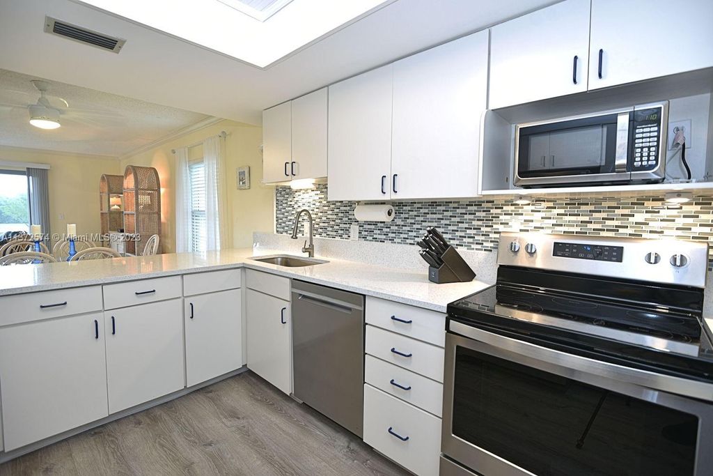 Photo of 18459 SE Wood Haven Ln #J, Jupiter, FL 33469 (MLS # A11372574)