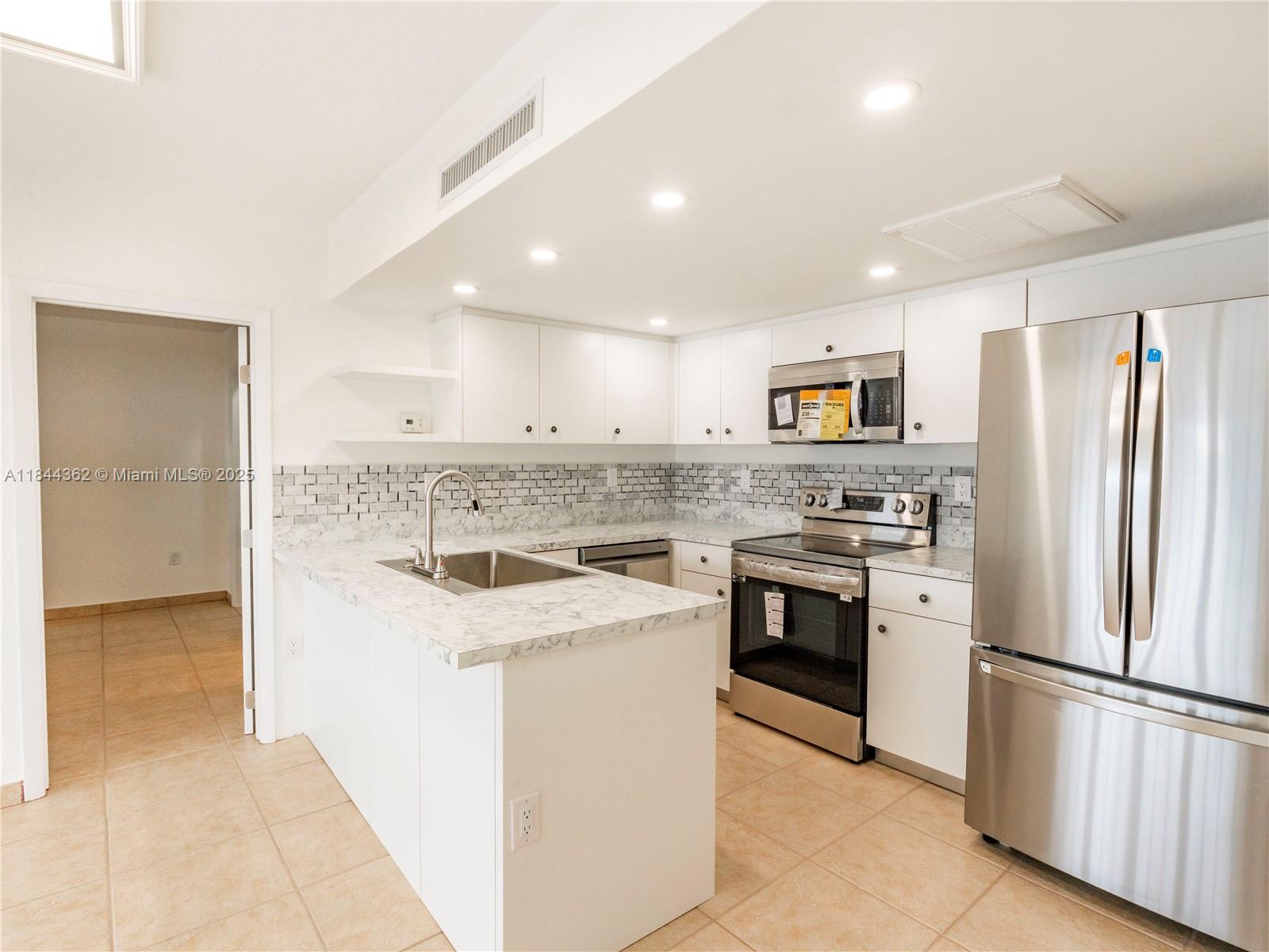 Corner townhouse unit in beautiful Windmill Gates with three assigned parking spaces. Brand new kitchen with all new appliances, freshly repainted, tile floors throughout, split floor-plan, washer/dryer, walk-in closets, outdoor storage closets and private patio. Located in Miami Lakes close to restaurants, shops, supermarkets and directly across from Miami Lakes Optimist Park.