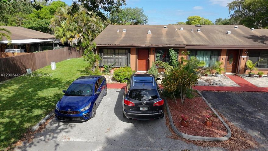 Welcome to this charming 2-bedroom, 2-bathroom end-unit townhome located in the Cedarwood community of Pembroke Pines. This unique residence features a spacious layout with a versatile loft area, perfect for additional storage or flex use. As you enter, you’re greeted by a warm and inviting living and dining space highlighted by stunning vaulted cedar ceilings with exposed beams that extend throughout the main living area and into the primary bedroom, creating a cozy yet open atmosphere. The kitchen offers ample cabinetry and countertop space, along with a convenient in-unit washer and dryer setup. The layout is ideal for everyday living and entertaining, with a natural flow from the kitchen into the dining and living areas. Step outside to a private, spacious patio surrounded by greenery and fruit trees—perfect for relaxing or hosting guests. This end-unit provides added privacy and natural light, making it feel even more inviting. The community features a low HOA of just $124/month and maintains a no-leasing policy for the first two years of ownership. Conveniently located just minutes from Pembroke Lakes Mall, Memorial Hospital West, and C.B. Smith Park, this home offers a great blend of character, comfort, and location.