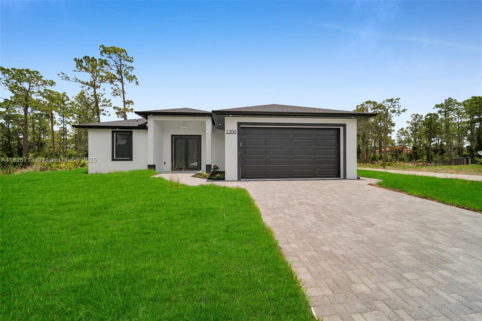 Brand New Construction on a Corner Lot. Situated on a desirable corner lot, this 3-bedroom, 2-bathroom home offers modern living with thoughtful upgrades throughout. Enjoy the elegance of quartz countertops and sleek porcelain tile flooring that flows seamlessly through every room. The open-concept layout is perfect for both relaxing and entertaining. Located in a quiet residential neighborhood, this home is ideal for buyers looking for peace and convenience. Just minutes from shopping, dining, and essential services. Nearby schools include G. Weaver Hipps Elementary, Lehigh Acres Middle, and Lehigh Senior High School. Convenient access to major roads makes commuting a breeze. Don't miss your opportunity to own a brand-new home in one of the most up-and-coming areas of Lehigh Acres!