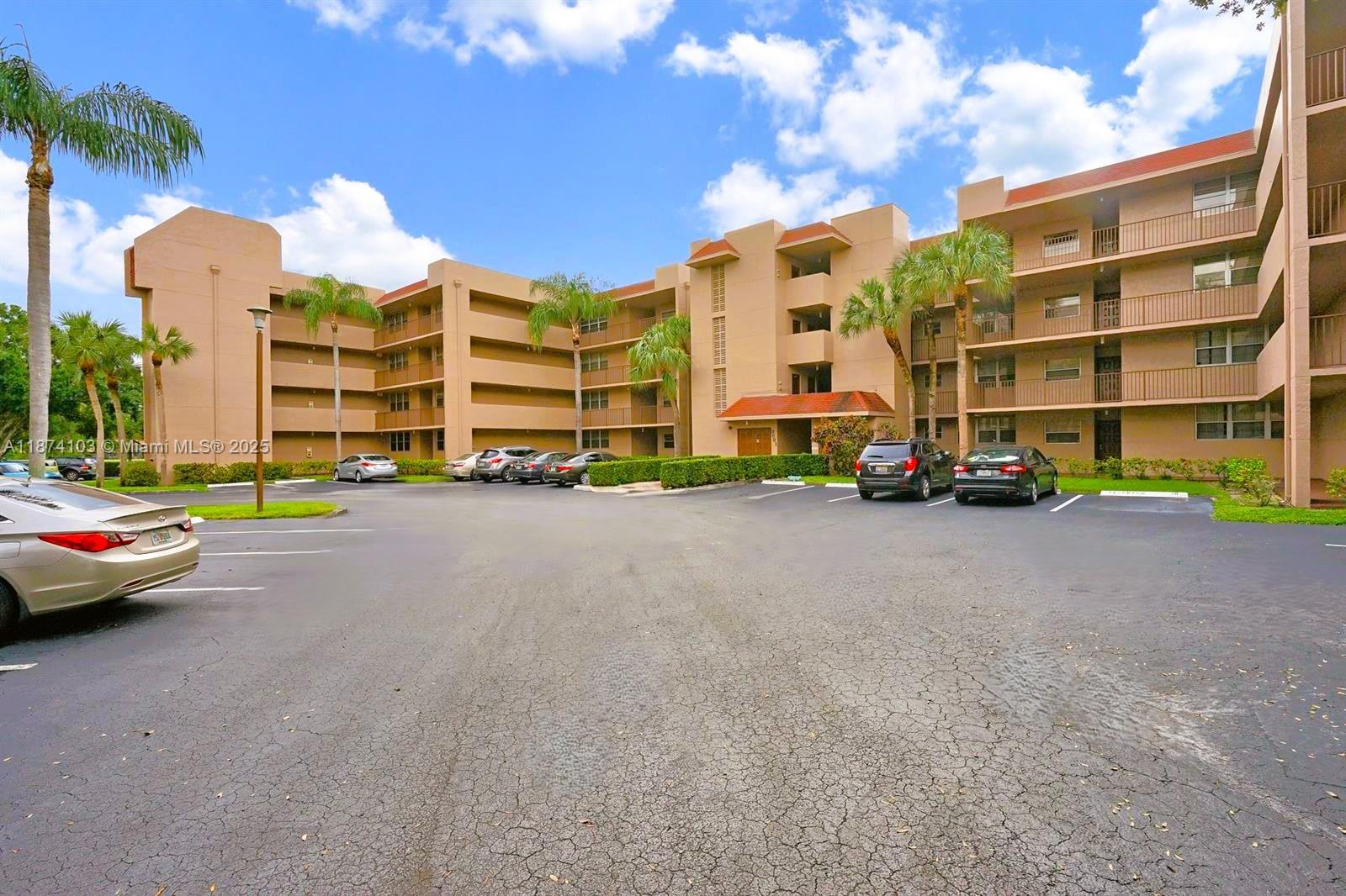Experience comfort & convenience in this first-floor corner unit featuring three bedrooms & two bathrooms. The residence includes a dedicated breakfast area, Florida room, washer/dryer, pantry, & ample closet space, all situated within the sought-after Pine Island Ridge community. This private corner unit is enhanced by abundant natural light & panoramic views of the golf course. Residents have privileged access to club amenities, including two on-site restaurants, a fitness center, swimming pools, as well as tennis, pickleball, & bocce ball courts. Golf is available on a state-of-the-art 18-hole course for a nominal fee. Additionally, the unit’s desirable corner 1st floor location offers convenient proximity to parking. Easy access to shopping, Universities, restaurants & major roads.