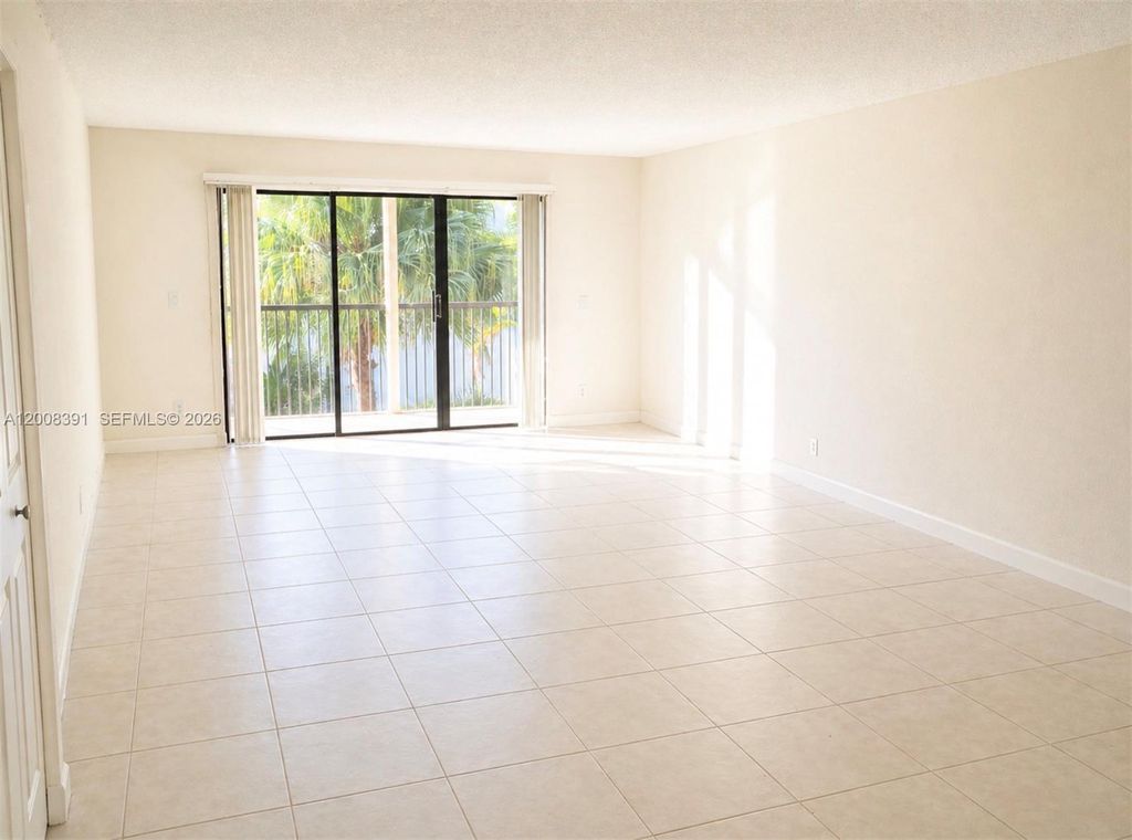 Photo of 405 Lakeview Dr #202, Weston, FL 33326 (MLS # A12008391)