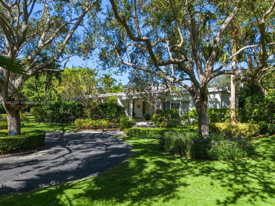 This 3-bedroom, 3-bathroom 3,386 SF home is on one of the most desirable streets in Pinecrest, on an expansive 40,510 SF lot. The residence exudes charm with a covered porch entry, a large side covered porch, with a sprawling layout showcasing stunning exposed vaulted whitewash beam ceilings . The light and bright eat-in kitchen has custom cabinetry with ample storage, wall pantry, a large center island, beautiful marble countertops, and a breakfast dining area. Perfect for entertaining, the beautiful and serene backyard includes a sizable, covered terrace and pool. Additional features include a two-car garage, partial impact windows and doors, and two fireplaces. A prime location in one of the best school districts.