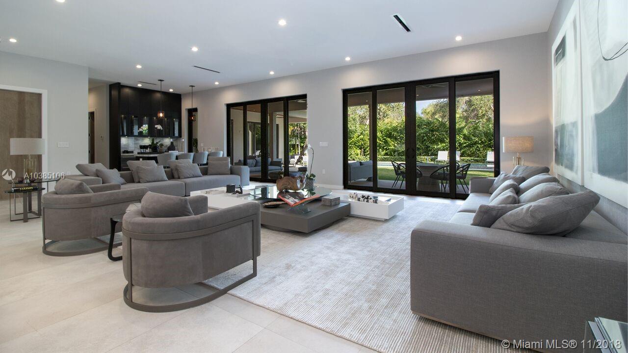 FINALLY COMPLETE! Unique opportunity to own a new home in the private, secure and exclusive community of Bay Point. Enter this 6 Bed/6.5 Bath home into a light-filled great room with a custom built bar overlooking a wrap-around terrace outfitted with summer kitchen. Grassy yard and lush landscaping surround the pool and over spilling jacuzzi. Downstairs, a welcoming and spacious master suite with access to the exterior. Upstairs, two bedrooms with en-suite baths, an additional family room and separate W/D. Among a long list of features, the home also boasts: high-end finishes, custom built cabinetry, beautifully appointed Chef's kitchen with Wolf and Sub-Zero appliances, and a 2 car garage. Great home for a large family who loves to entertain!