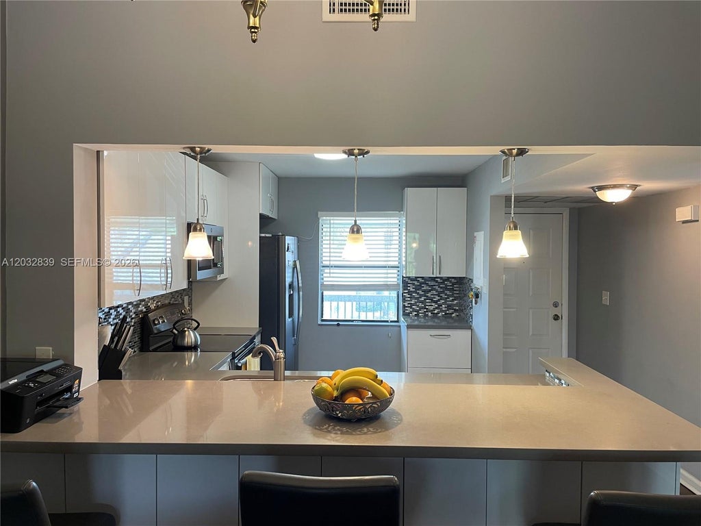 Photo of 3871 N Carambola Cir N #2955, Coconut Creek, FL 33066 (MLS # A12032839)