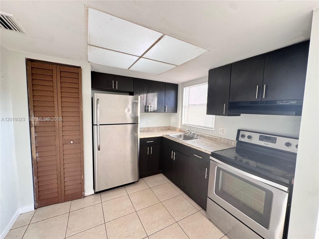 Photo of 101 NE 41st St #A9, Oakland Park, FL 33334 (MLS # A12019323)