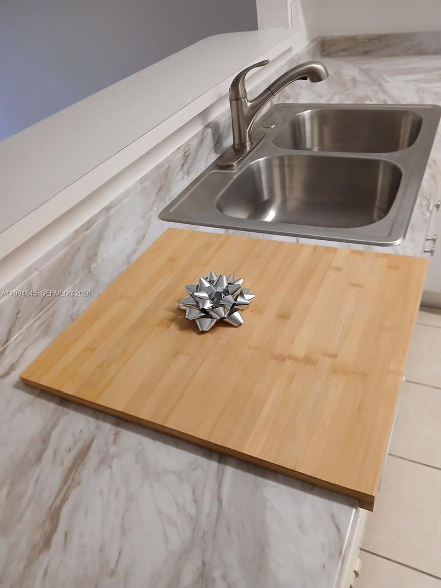 This property is a two-story townhome with 3 bedrooms and 2.5 baths, freshly painted and completely updated with new premium wood-like vinyl flooring on the stairs and the entire second floor; fully renovated kitchen cabinets and countertops including also new sink, water connections and drains, faucet, waste disposal and main valves; new bathroom vanities featuring quartz tops are just installed, including as well new water connections, main valves and drains for a long lasting peace of mind; new painted bifold doors, lamps and locks, with new blinds on all the windows and sliding doors, that have all just been serviced, including brand new screens and new locks for all the hurricane shutters and a fully paved back yard with a just installed new fence; just to make sure all works perfect for your convenience. 

This townhome is located at Villas at Carmel, a very well-kept neighborhood part of Malibu Bay a safe and beautiful gated community, with a privileged location on Campbell Dr at less than 2 miles straight from the Turnpike access ramp and conveniently nearby to great shopping and dining places; It features lake views, walking areas and a gorgeous clubhouse with swimming pool, gym and regular activities for its residents,

This is your opportunity to own a beautifully remodeled, turnkey, two story townhome at a very good price.

A little present for the new owner, has been left behind.