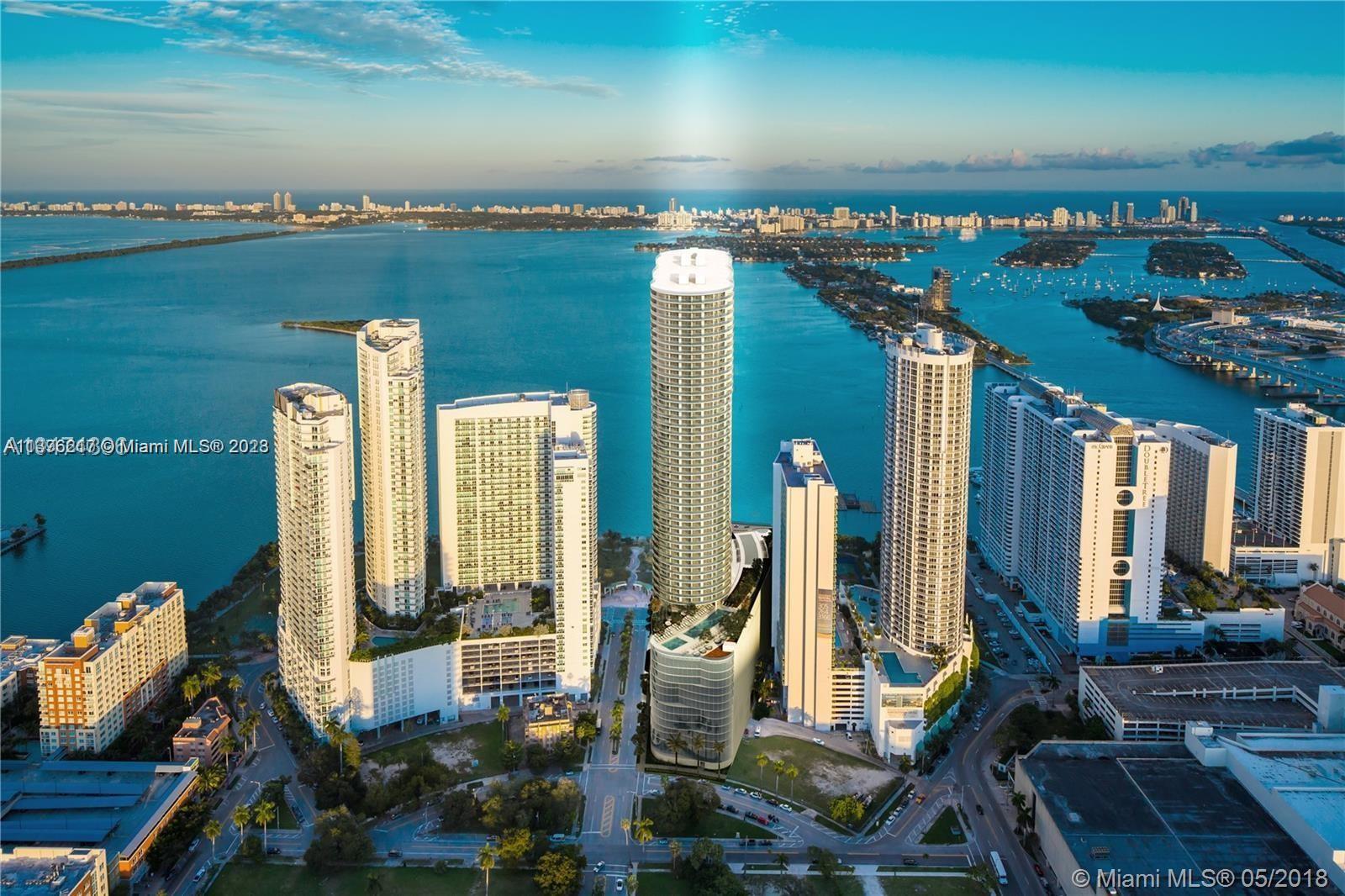 Aria on the Bay condos is a luxury high-rise development located in Edgewater Miami. Aria on the Bay condos offers an array of posh amenities, including a sunrise and sunset pool, hot tub overlooking Biscayne Bay, movie theater, state-of-the-art fitness center and yoga studio, spa and massage treatment area, BBQ area with summer kitchen, teen lounge and kids’ playroom, business center with conference room and offices, outdoor fire pit, great room with flat-screen TVs and pool tables, valet parking, concierge services, and complimentary WiFi in all common areas.
