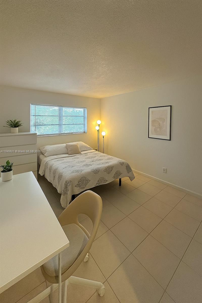 Discover this bright and spacious 1-bedroom unit designed for comfort and convenience! Featuring tile flooring throughout, a large bedroom with generous natural light, and a modern bathroom with dual vanities, this home is both functional and stylish. Enjoy a dedicated workspace, ample storage, and updated fixtures that make daily living a breeze. Located in a quiet, well-maintained building near shopping, dining, and major transit routes—this is the perfect place to call home. Ideal for professionals, students, or anyone seeking a clean, move-in-ready space. Schedule your private showing today before it’s gone!