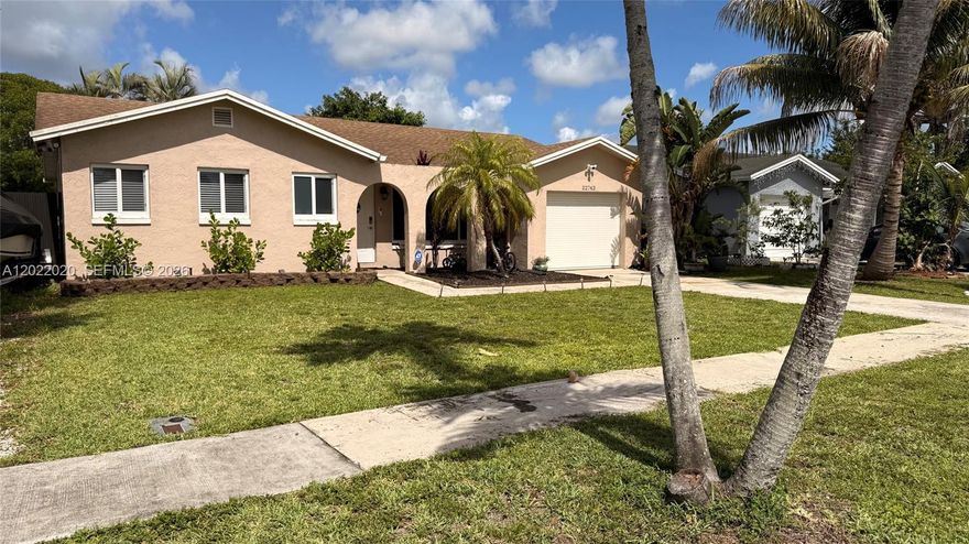 Water view charming home. 6 years roof. Impact windows/doors. Unit throughout has been remodeled and well maintained.  A/C 3 years. Tile in social areas. Vinyl floors in bedrooms. No HOA. Good school district rated A&B. Metal new partial fence. New dishwasher. Other appliances 6 years. Water filter included. Relaxing canal view. Nice patio. Mango tree. Sprinkler system utilizes the canal water. There is additional parking perfect for your RV or boat. This one will not last. Garage converted to third bedroom by permit. Owner occupied. Showing assist for appointment. Easy to show.