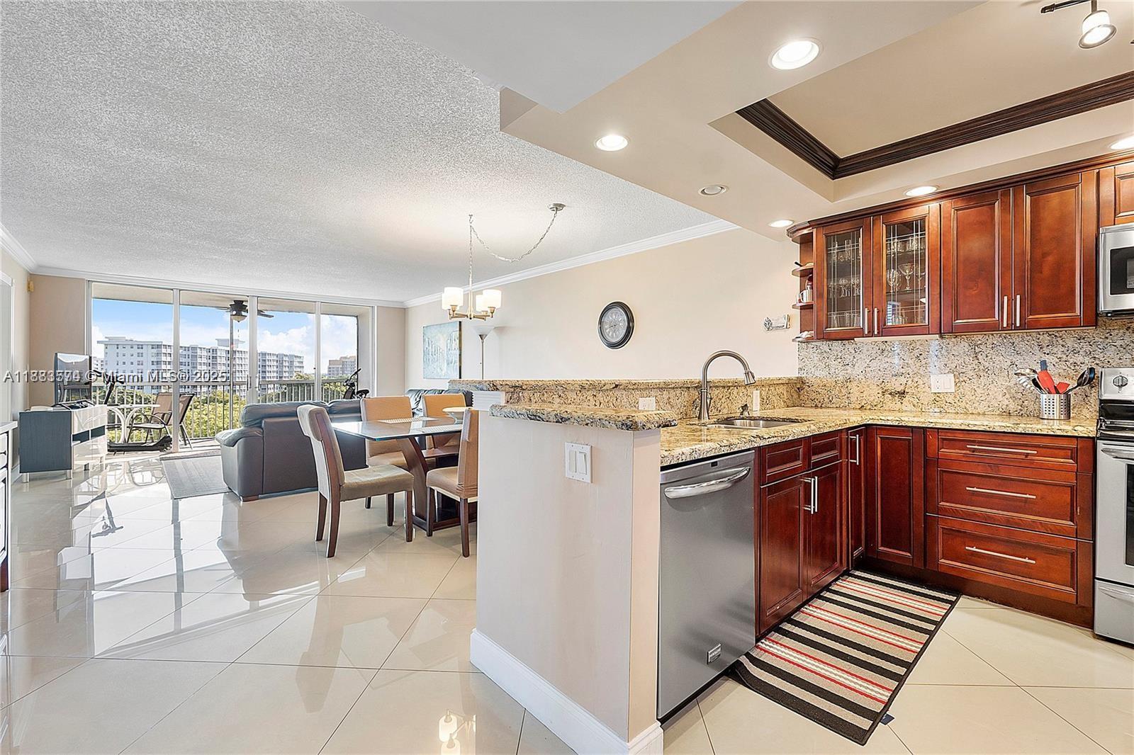 Wow! Beautiful Corner Unit W/ Breathtaking Lake Views From Balcony & All Bedrooms At Palm Aire Country Club. This Beautifully Designed Home Boasts A Split Floorplan/Porcelain Plank Tile Flooring Throughout. The Upgraded Kitchen Features Granite Countertops, Wooden Cabinets W/ Pantry, Stainless Steel Appliances, Garbage Disposal, & Dishwasher. Spacious Dining & Living Room W/ Recessed Lighting & Crown Molding Throughout. Large Balcony W/ Sliding Doors Offers Spectacular Views. Master Bedroom Has A Walk-In Closet, Storage Closet, & Full Shower W/ Glass Frame. Ceiling Fans In Every Room. Association Fee Covers Building Exterior, Amenities, Roof, Common Areas, & Insurance. Right Next To The Pool! Property is Furnished. A Must See!