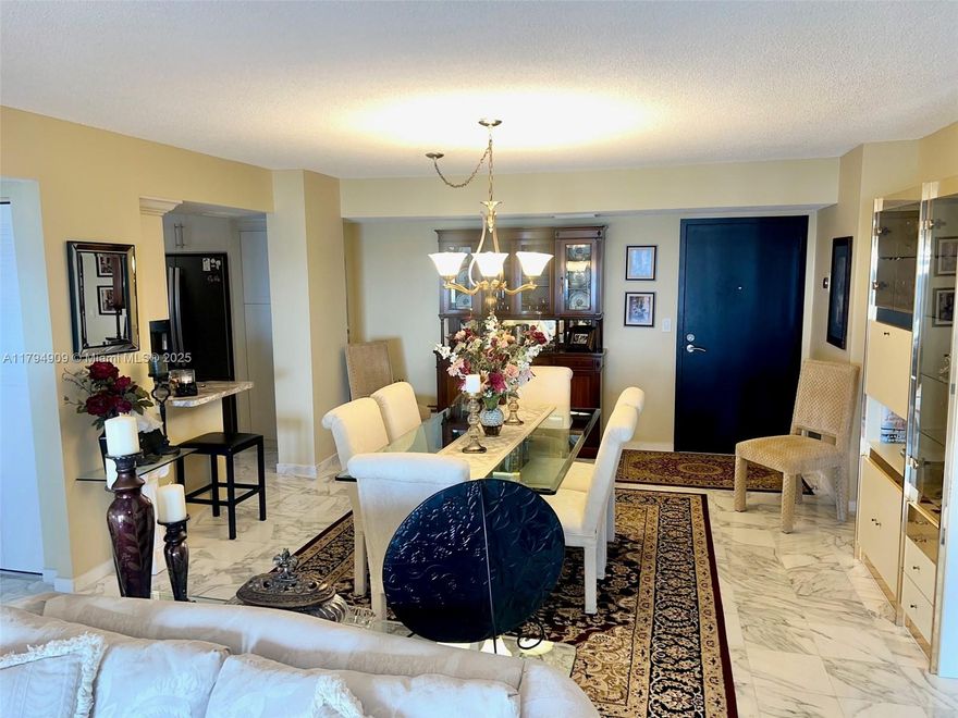 Breathtaking ocean and Intracoastal views from every room in this spacious 2BR/2BA corner unit with wrap-around balcony. Features impact windows & doors, marble floors, and a beautifully upgraded kitchen with tall off-white cabinets, dark stainless steel appliances, soft-close drawers, built-in pantry, spice rack, and lazy Susan. Enjoy a waterfront pool, new gym equipment, sauna, and direct beach access just steps from the Hollywood Boardwalk. Walk to shops and restaurants. Only 10 mins to FLL Airport & Gulfstream Park. All assessments for 40- & 50-year recertifications to be paid by seller at closing.
