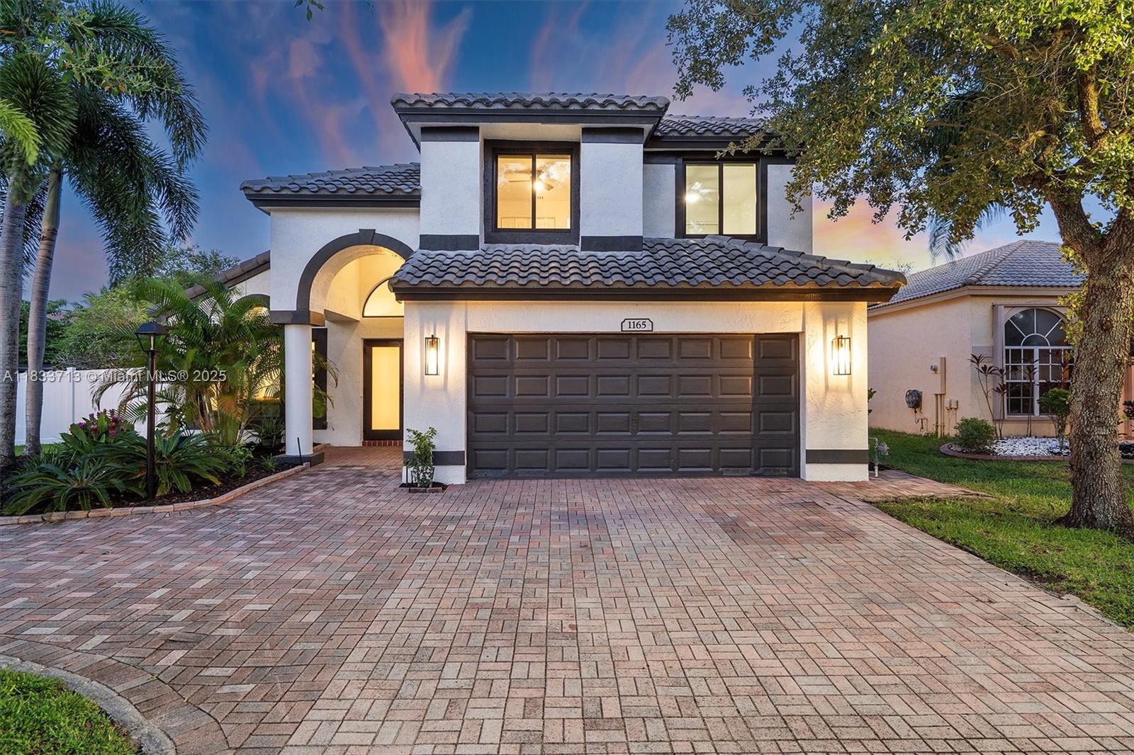 Stunning fully renovated 2-story waterfront home with 4-Bed / 2.5-Bath in gated community of Pembroke Falls! Contemporary kitchen featuring quartz countertops, large kitchen island, and stainless appliances. Open floor plan with soaring ceilings, luxury tile flooring, and a breathtaking panoramic lake view. Spacious primary suite on the first floor. 3 spacious bedrooms located on the 2nd floor. Half bathroom conveniently located on the 1st floor. Large fully fenced backyard with covered area, and plenty of space for a pool. Roof 2021, AC 2022, New Impact windows & doors. Resort-style amenities include a clubhouse with a gym, pools, tennis courts, etc. Prime location near major highways and shops! Bundled service pricing available for buyers. Connect with the listing agent for details.