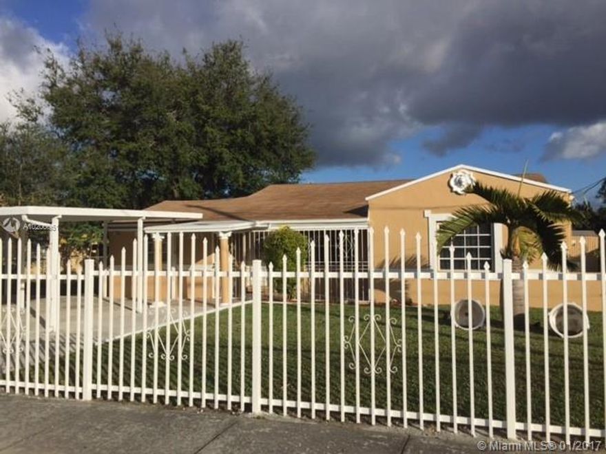 BEAUTIFUL 4/2  HOME WITH new kitchen and baths; Tile throughout. Gated and Secured Off Street parking. Updated Electrical and Central A/c. Professional landscaped and NEW ROOF.