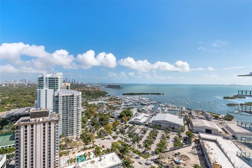 Breathtaking Penthouse at prestigious Grove at Grand Bay, in the heart of Coconut Grove. Large balconies and outdoor living, dining and BBQ overlooking Biscayne Bay. Over $1 million in upgrades Professionally Decorated open contemporary layout with 12 ft ceilings, Odysseus white marble flooring, Porcelanosa and Roche Bobois wall coverings, automated shade system throughout, Gourmet professional gas kitchen, Miele Appliances, water purifying system. Unique Penthouse with private rooftop area, pool and its own private elevator and inside staircase access. Must see to experience this almost 7,000 sq feet beauty.