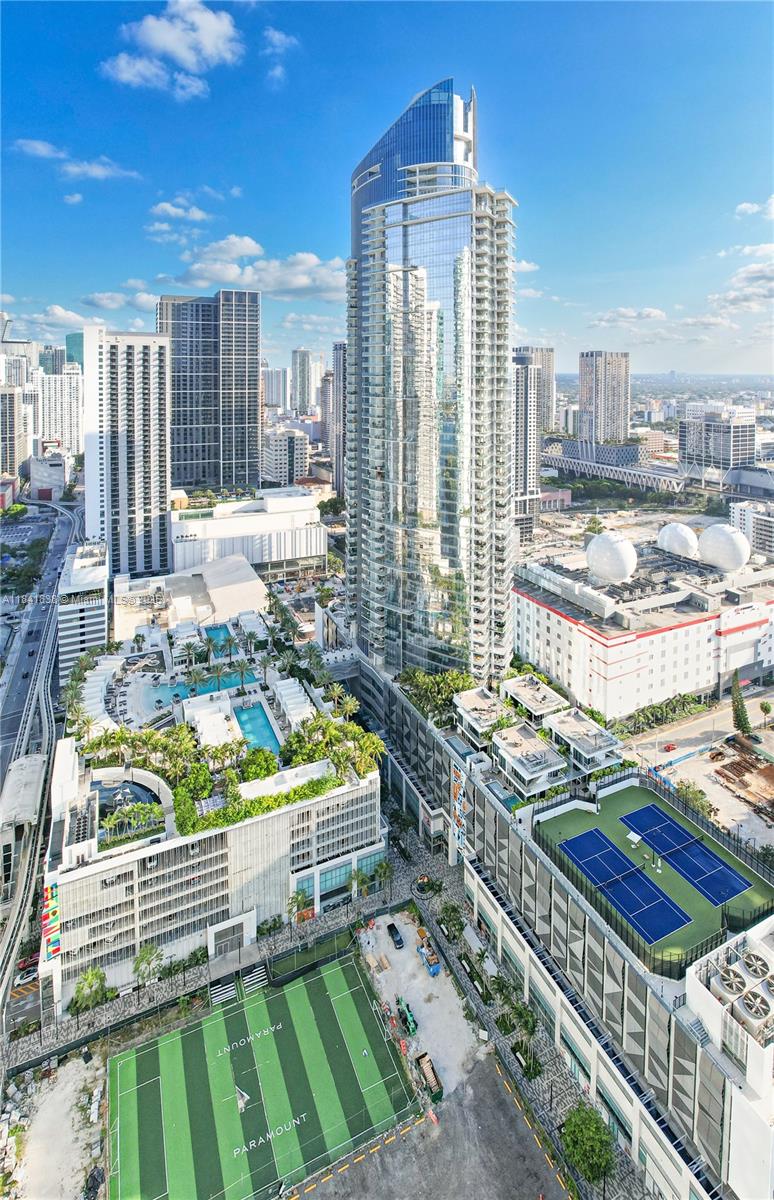 Experience luxury living in this stunning 4-bed, 4-bath furnished residence at the iconic PARAMOUNT Miami Worldcenter. Designed with high-end finishes, it blends elegance and comfort for a sophisticated urban lifestyle. Enjoy 46 world-class amenities including resort-style pools, fitness center, spa, rooftop observatory, and more. Every day feels like a five-star experience. Located in the heart of Downtown Miami, you're steps from dining, entertainment, cultural venues, and major transit hubs. Available starting August 15. Live extraordinary—make PARAMOUNT your new home.